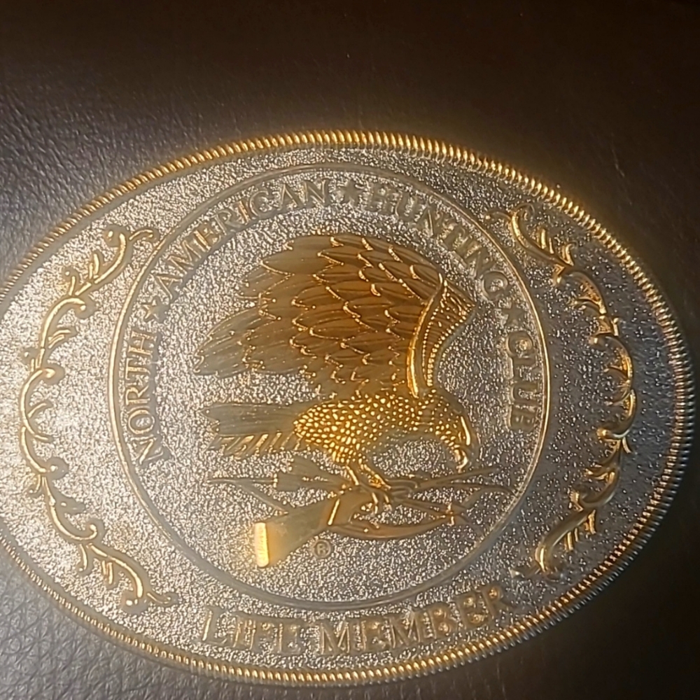 Belt buckle over and gold North American hunting club